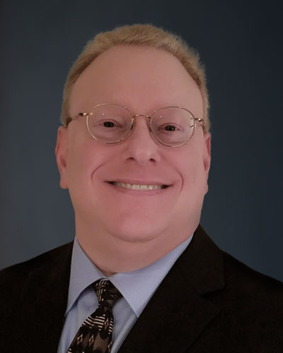 A head shot photograph of Dr. Danny Schaeffler